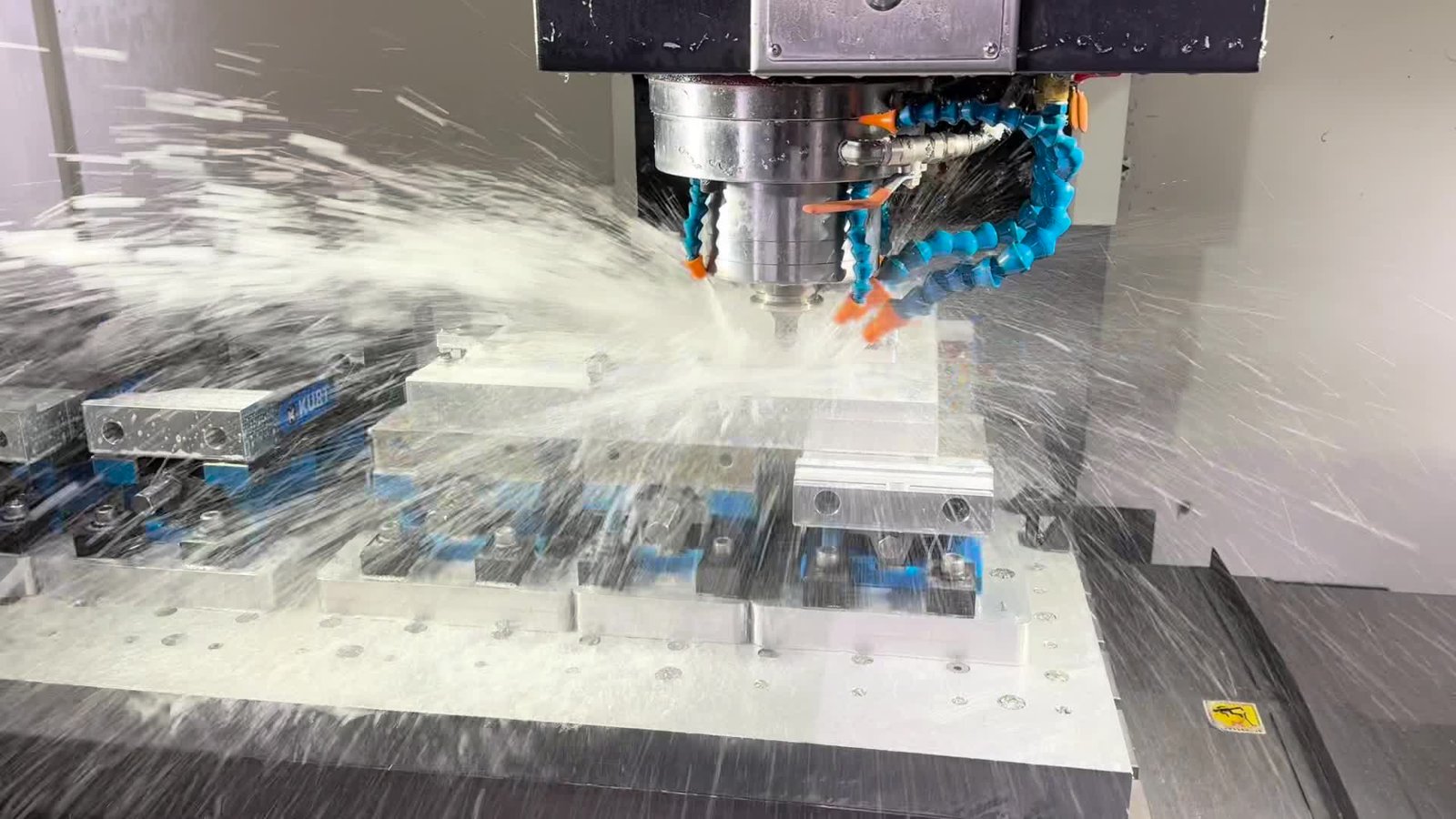 Vertical machining center milling aluminum stock